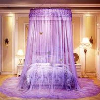 different coloured round mosquito nets image 1