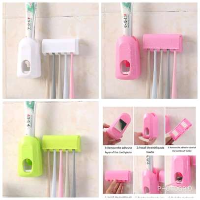 Toothpaste dispenser with holder image 1