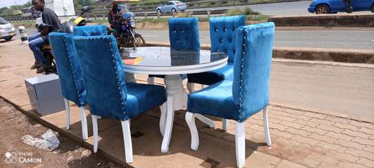 Six seater dining table made by glass on the top image 1