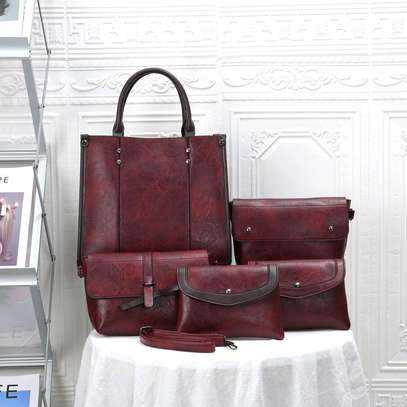 *Quality Original Designer Ladies Business Casual Rubber 5 in 1 Legit  Handbags Backpack Clutch Wallet Set*
. image 1