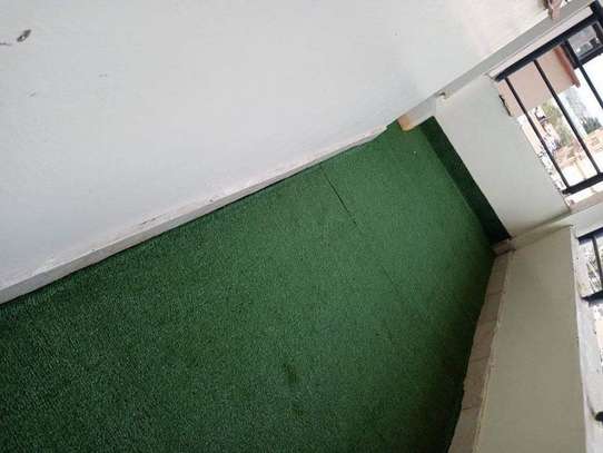 get a classy balcony with artificial grass carpet image 1