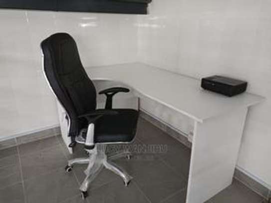 Height adjustable ergonomic chair and an L desk image 1