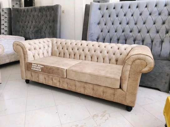 Modern brown three seater chesterfield sofa image 1
