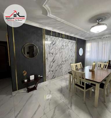 Black flutted panels with granite center interior design image 3