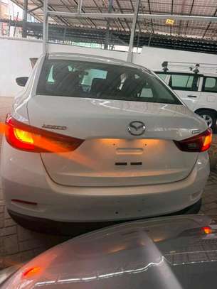 Mazda Demio sedan white image 10