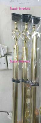 Gold long curtain rods.. image 1