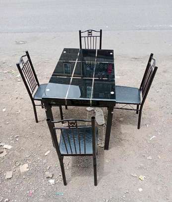 Black fine touch dining table with seats image 1