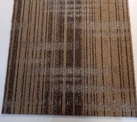 Brown Patterned carpet tile adding warmth to homes/ offices image 1