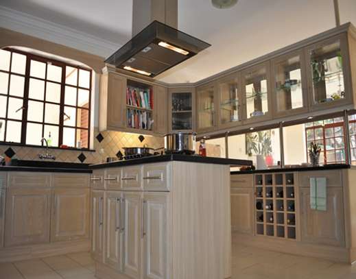 Meru oak kitchen cabinets &wardrobes installation image 4