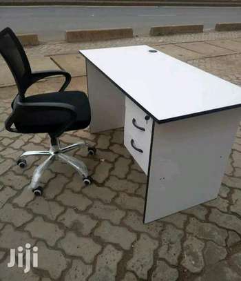Office table and a swivel chair image 1
