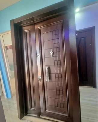 double door in brown walnut with a wooden finish image 1