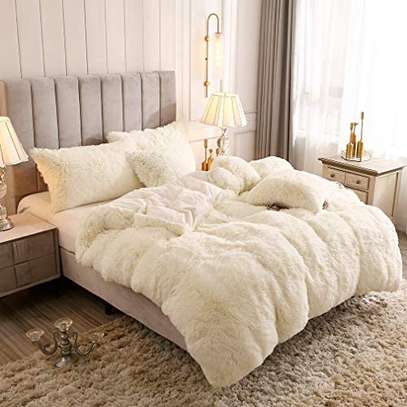 Fluffy duvets with one bed sheet one duvet four pillow cases image 1