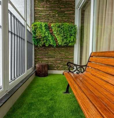 Welcoming green look only with artificial grass carpet image 3