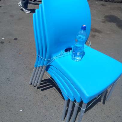 Stackable Plastic Chairs with Metallic Stands image 1