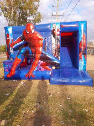 Boys' bouncing castles available for hire image 2