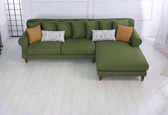 L shape sofa with bouncy cushions and lower wooden skirting image 5