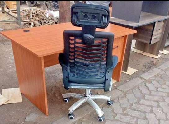 Ergomax computer desk with an office chair image 1