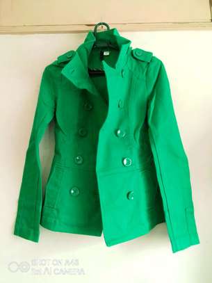 Green trenchcoat + matching green earrings image 7