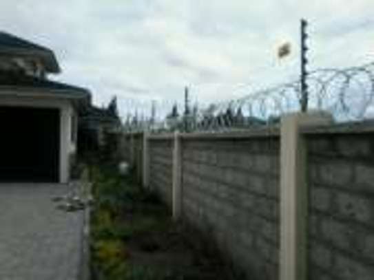 Electric Fence and Razor Wire Installation in Kenya image 7
