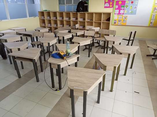 Triangular design of locker with chairs image 3