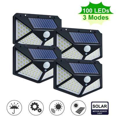 4 pack 100LED Solar Powered PIR Motion Sensor Wall Light Outdoor Garden Lamp 3 Modes image 1