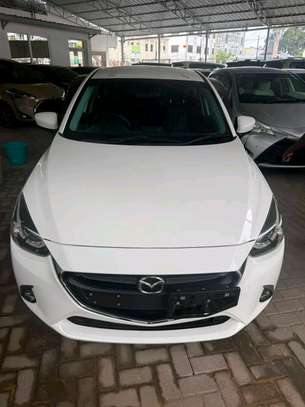 Mazda Demio sedan white image 9
