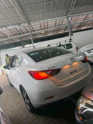 Mazda Demio sedan white image 2