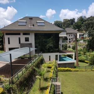 Rent:711,000
Lower kabete 
5 bedroom Villa with a private pool for rent, Lower Kabete, Nairobi

Located within a gated community of 10 houses on approx half acre each is this state of the art smart home with all the bells and whistles.

The developer has spared no expense in this home which features smart home system which control lighting, curtains, fountains, sound system amongst other features.

This home features 5 large bedroom all of which are en-suite with only the best European fittings and sanitary ware, an Italian kitchen with German built in appliances, a home gym, a full home theatre together with a home cinema and sound system, CCTV all through the house, a private pool for each home as well as solar system and back up Genset.

This 5 bedroom villa takes living to another level of sophistication and luxury! With approx 10,000 Sqft of built up space in approx half an acre this home is value for money.

If you are in the market for a well thought through home with finishing only found in the west look no further.

Viewings are strictly on appointment.

Rent for this 5 bedroom villa: USD 5,500/month