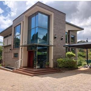 Rent:USD 8000
Lower kabete 
Furnished 
5 bedroom Villa with a private pool for rent, Lower Kabete, Nairobi

Located within a gated community of 10 houses on approx half acre each is this state of the art smart home with all the bells and whistles.

The developer has spared no expense in this home which features smart home system which control lighting, curtains, fountains, sound system amongst other features.

This home features 5 large bedroom all of which are en-suite with only the best European fittings and sanitary ware, an Italian kitchen with German built in appliances, a home gym, a full home theatre together with a home cinema and sound system, CCTV all through the house, a private pool for each home as well as solar system and back up Genset.

This 5 bedroom villa takes living to another level of sophistication and luxury! With approx 10,000 Sqft of built up space in approx half an acre this home is value for money.

If you are in the market for a well thought through home with finishing only found in the west look no further.

Viewings are strictly on appointment.

Rent for this 5 bedroom villa: USD 8000/month