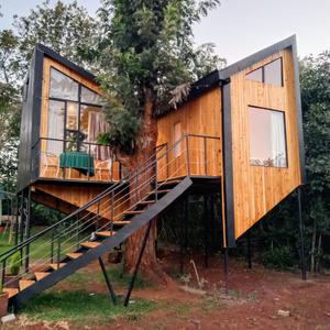 Experience a one-of-a-kind stay in this beautifully crafted tree house, offering the perfect blend of nature, comfort, and privacy. Surrounded by lush greenery, this unique retreat is ideal for those seeking a peaceful escape without compromising on modern conveniences.

Features:

Unique tree house design
Spacious main bedroom
Cozy loft bedroom
Well-appointed kitchenette
Private garden
Outdoor fire pit, perfect for relaxing evenings or entertaining
Bright, airy interiors with beautiful views of the surrounding greenery
A charming retreat that combines rustic character with modern comfort, creating a tranquil living experience in a truly unique setting.