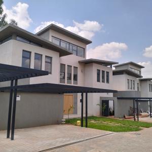 it is perfect blend of modern 4bedroom  town house  . characterized by the latest design and finishes.
it has the following numerous features
staff quarter for one
large lounge cum dining and adjoining balcony
large windows to maximize natural light and air circulation
 two modern kitchen fitted with cooker and oven
has a dhobi area
wooden flooring except the wet areas that contain ceramic tiles
each bedroom has a high quality inbuilt wardrobe.
master bedroom has bath tub and wadrobes
each bedroom has a sliding windows
internet connected,
alarm systems intercom.
garden well manicured 
CCTV cameras around
perimeter wall with electric fence round
24 hours security from KK security compan