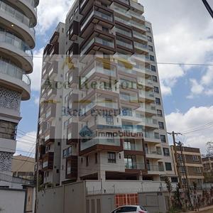 Property Overview
....................................................
Positioned along prestigious General Mathenge Road within prime Westlands.
This executive duplex apartment combines elegance with everyday practicality.
Thoughtfully designed interiors maximise natural light and spatial comfort.
The residence occupies a desirable position within a modern development.
Residents enjoy exceptional convenience within Nairobi's premier neighbourhood.
Contemporary finishes create an inviting and sophisticated living environment.
Interior Features
....................................................
Three spacious bedrooms provide comfortable accommodation for modern families.
Well-planned layouts encourage effortless movement throughout the residence.
The expansive lounge creates a welcoming setting for relaxation.
An adjoining dining area enhances everyday family interactions beautifully.
A fully fitted kitchen supports efficient and enjoyable meal preparation.
Generous kitchen seating creates a practical informal gathering space.
Private terraces capture refreshing views across the surrounding neighbourhood.
A self-contained DSQ provides valuable flexibility for household requirements.
Dedicated utility areas simplify laundry and daily household management.
Exterior Features
....................................................
The striking fourteen-storey development enhances Westlands' contemporary skyline.
Secure access promotes privacy and peace of mind.
Two designated parking spaces offer everyday convenience for residents.
Professionally maintained common areas reinforce the property's premium appeal.
Development Amenities
....................................................
A rooftop swimming pool offers relaxation above the city.
The modern gymnasium supports active and healthy living.
A community hall accommodates meetings and social gatherings comfortably.
A dedicated playroom enhances convenience for family-oriented lifestyles.
Two passenger lifts ensure smooth movement throughout the building.
Full backup power guarantees uninterrupted comfort during outages.
Borehole water supply enhances reliability for everyday use.
CCTV surveillance strengthens security across the development.
A twenty-four-hour reception desk ensures professional resident assistance.
Lifestyle Appeal
....................................................
General Mathenge Road remains among Nairobi's most distinguished addresses.
The location effortlessly balances tranquillity with urban accessibility.
Residents enjoy sophisticated living within a vibrant cosmopolitan community.
Nearby lifestyle destinations elevate daily convenience and entertainment.
The rooftop amenities encourage wellness, relaxation, and social connection.
Tenancy Advantages
....................................................
Ready occupation allows a seamless transition into your new home.
The duplex design offers enhanced privacy and functional separation.
Premium amenities reduce reliance on external recreational facilities.
Reliable utilities support uninterrupted comfort throughout the year.
Secure management ensures confidence for residents and families.
Neighbourhood Advantages
....................................................
Westgate Mall provides exceptional shopping and dining experiences nearby.
Sarit Centre offers retail, entertainment, and lifestyle conveniences.
Leading educational institutions are located within easy reach.
Premier healthcare facilities support comprehensive family wellbeing.
Excellent road connectivity simplifies commuting across Nairobi.
The neighbourhood enjoys a strong sense of community.
Rental Terms
....................................................
Monthly Rent: KES 120,000.
Status: Available for immediate occupation.
Configuration: Unfurnished executive duplex apartment.
Parking Allocation: Two designated parking spaces.
DSQ: Self-contained staff accommodation included.
Lease Duration: Available upon request.
Property Size
....................................................
Internal Area: 130 Sq. M.
Internal Area: Approximately 1,399 Sq. Ft.
Call To Action
....................................................
Experience executive duplex living within prestigious General Mathenge Road.
Schedule a private viewing with ACE REALTORS today.
Contact our leasing team for further details and availability.