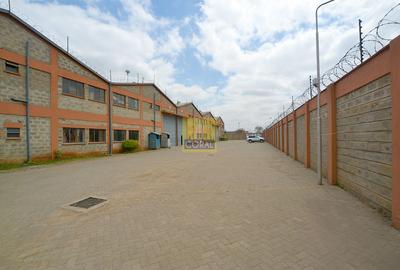 Warehouse with Electric Fence in Industrial Area