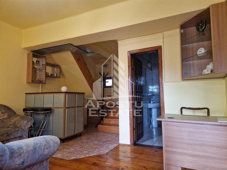Casa familiala cu spatiu comercial si garaj P+1E+M 720 Mp