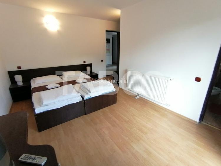 Pensiune 13 camere 16 bai sauna piscina si teren 1565 mp Cisnadioara - 25