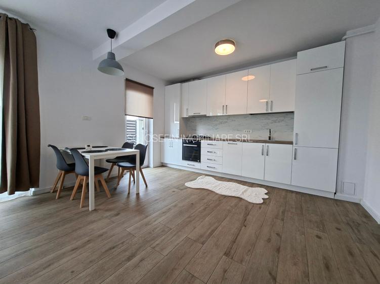 Bloc nou,  apartament   cu  parcare si curte proprie. - 2