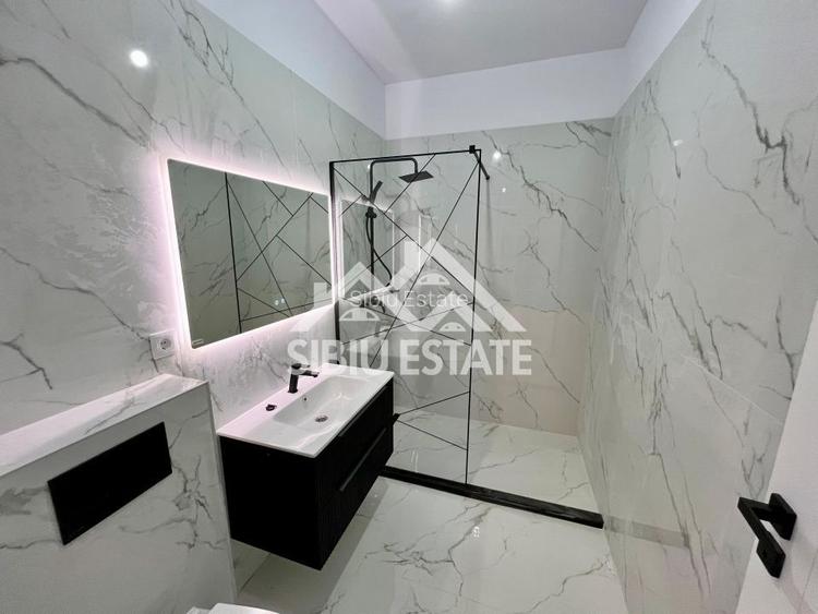Apartament cu 3 camere, 2 bai, boxa 20 mp. loc de parcare -Finisat la cheie - 6