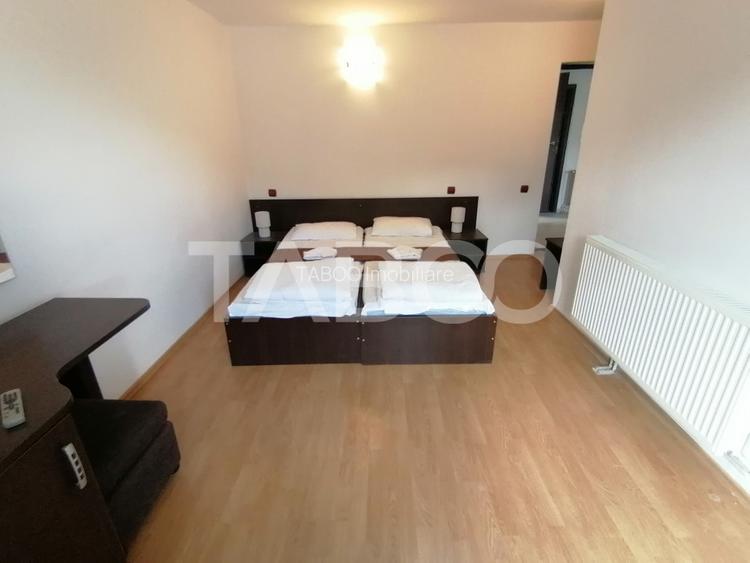 Pensiune 13 camere 16 bai sauna piscina si teren 1565 mp Cisnadioara - 21