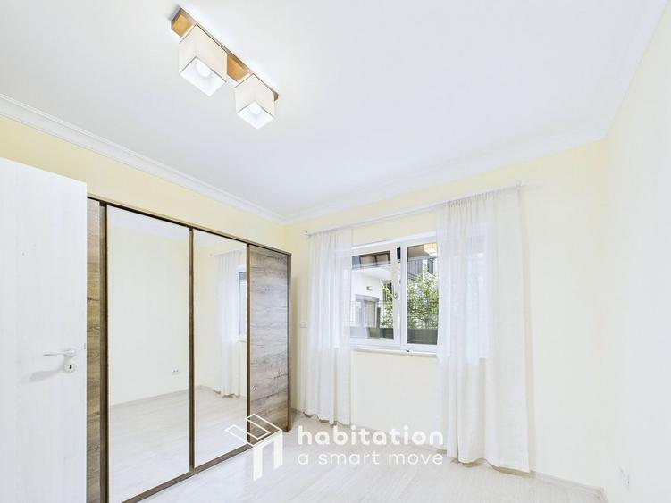 Apartament spațios cu curte și garaj – confortul unei case moderne