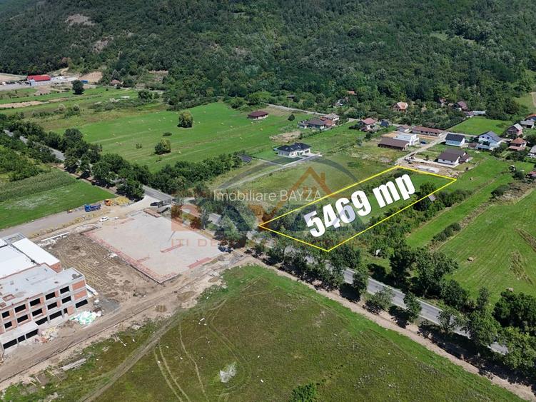 Teren intravilan - 5.469 mp, cu deschidere 44.4 m la DN1C - Cicârlău, Maramu - 3