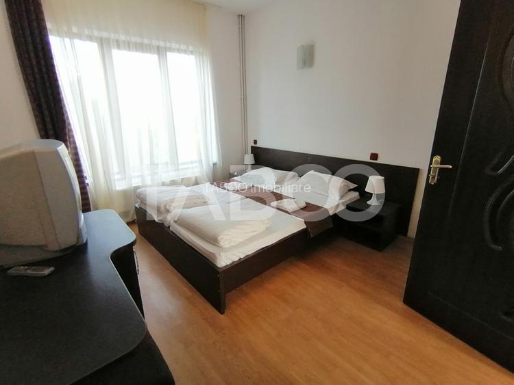 Pensiune 13 camere 16 bai sauna piscina si teren 1565 mp Cisnadioara - 31