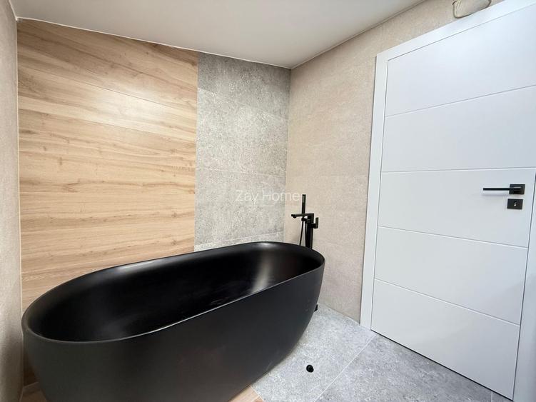 Ap pe 2 niveluri. 3 camere, 2 bai. 2 locuri de parcare. - 11