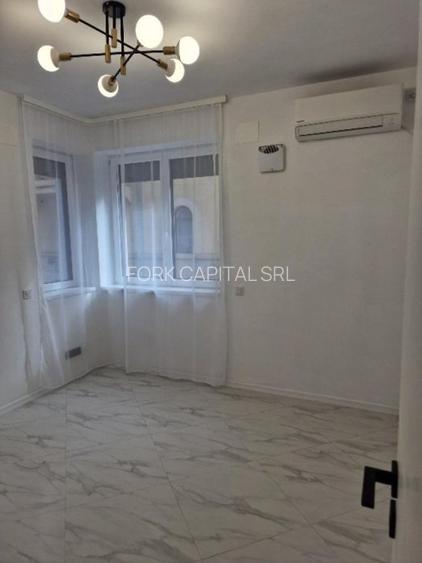 Piata Romana,  de inchiriat -5 camere, apartament nou in vila, parter, sect 1 - 10