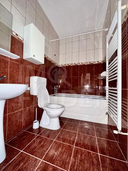 Spatiu amenajat ca locuire, 57 mp, demisol luminos, garaj inclus în Bună Ziua
