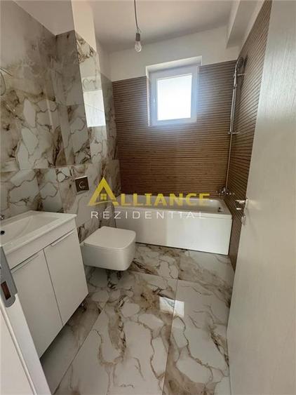 Apartament 2 camere tip Studio + 75 mp curte proprie