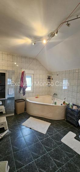 Ciorogarla-casa Sp+ P+M, garaj 2 loc+pod locuibil si casa oaspeti, teren=1097mp - 12