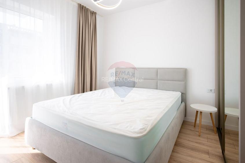 Apartament cu 2 camere de închiriat + parcare subterană în Tractorul - 12