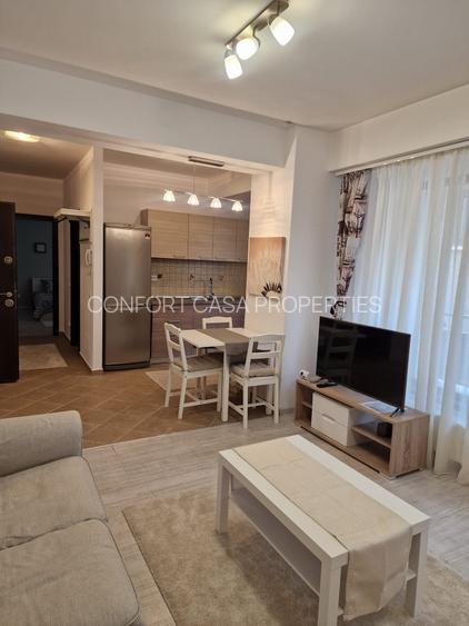 ASE -  Romana - Dorobanti - nou - 2 camere - mobilat modern - centrala termica - 18