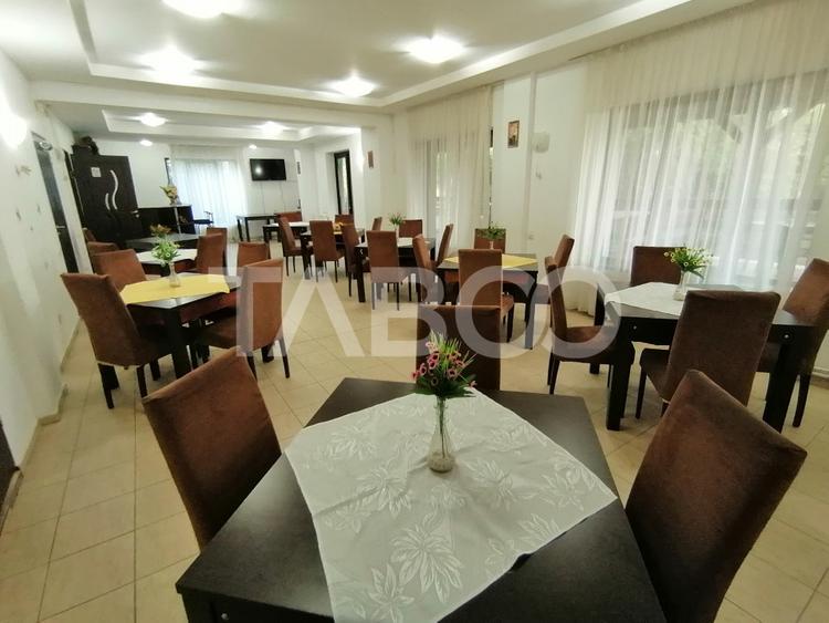 Pensiune 13 camere 16 bai sauna piscina si teren 1565 mp Cisnadioara