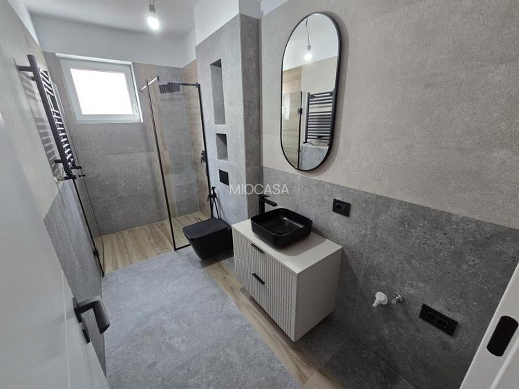 Apartament superb pe 2 niveluri. Bucatarie inchisa. 2 Locuri de Parcare. - 16